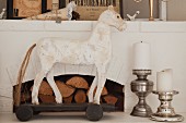 White horse ornament and pillar candles on silver candlesticks