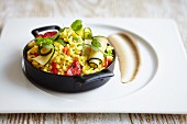 Paella with courgette rolls and peppers