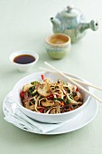 Fried noodles with Chinese cabbage, mushrooms and a cup of tea (China)