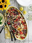 Couscous salad with vegetables and pomegranate seeds
