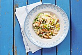 Seafood risotto with parsley, spring onions and peppers