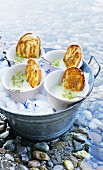 Cold cucumber soup with crispy, oven-roasted bread
