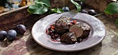 Roasted venison medallions with damsons