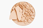 Crumbled beige face powder