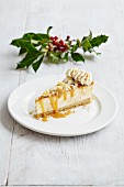 A slice of banoffee cheesecake with caramel sauce