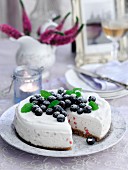 Cheesecake with summer berries, sliced