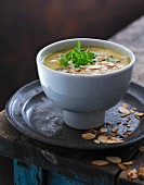 Cream of vegetables soup with roasted flaked almonds