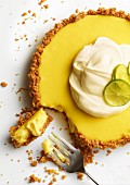 Key Lime Pie with a fork and a bite taken out