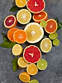 Various halved citrus fruits (seen from above)