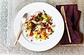 Grilled chicken and chicory salad with an orange dressing