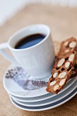 A cup of coffee and almond biscotti