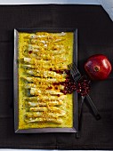 Gratinated black salsify with pomegranate seeds