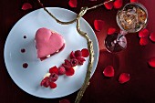 A heart-shaped macaroon with raspberries for Valentine's Day