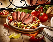 Beef fajitas with peppers and onions