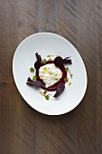 Burrata on a bed of beetroot