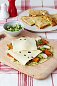 Toasted tortillas filled with chicken, sweet potatoes and Emmental cheese