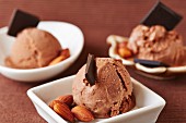Chocolate ice cream with chocolate curls and almonds