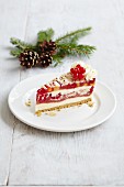 A slice of cheesecake with redcurrants and white chocolate for Christmas