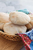 Freshly baked pita bread in a bread basket