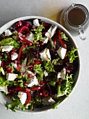 Mixed leaf salad with goat's cheese and pomegranate molasses