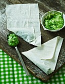 Filo pastry pockets with spinach and feta cream being made