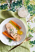 Poached salmon with carrots and celery