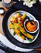 Polenta fritters with Romesco sauce