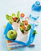 Spinach and tuna wraps in a lunch box