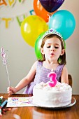 A little girl at a birthday party