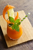 A carrot and pineapple smoothie with turmeric