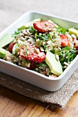 Quinoa and strawberry salad with spinach and avocado