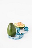 Fresh avocados with a measuring tape