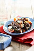 Beef with tomatoes and yoghurt sauce