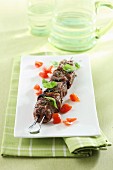 Grilled skewer with tomatoes and basil
