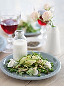 Green summer salad with yoghurt sauce and mozzarella