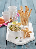 An artichoke and lemon dip with cheese twists