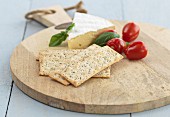 Camembert with poppy seed crackers and tomatoes