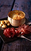 Cheese fondue with sausage and potatoes