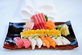 A mixed sushi platter with nigiri, maki and sashimi