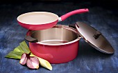 Kuhn Rikon set of pans: a ceramic coated frying pan and stainless steel pot in pink