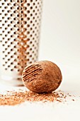 A whole nutmeg with a grater
