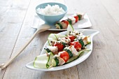 Salmon and vegetable skewers with rice
