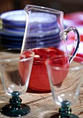Strawberry punch in a glass jug