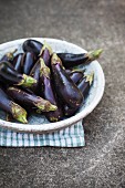 A bowl of baby aubergines
