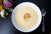 Cream of cauliflower soup with a fried cauliflower floret