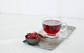 Fruit tea in a glass teacup