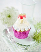 A summery cupcake with vanilla cream and strawberry jelly sweets