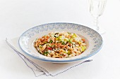 Seafood risotto with crab, parsley, spring onions and peppers