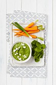 Spinach and spring onion hummus served with carrots