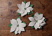 Hand-crafted paper flowers as Christmas decorations